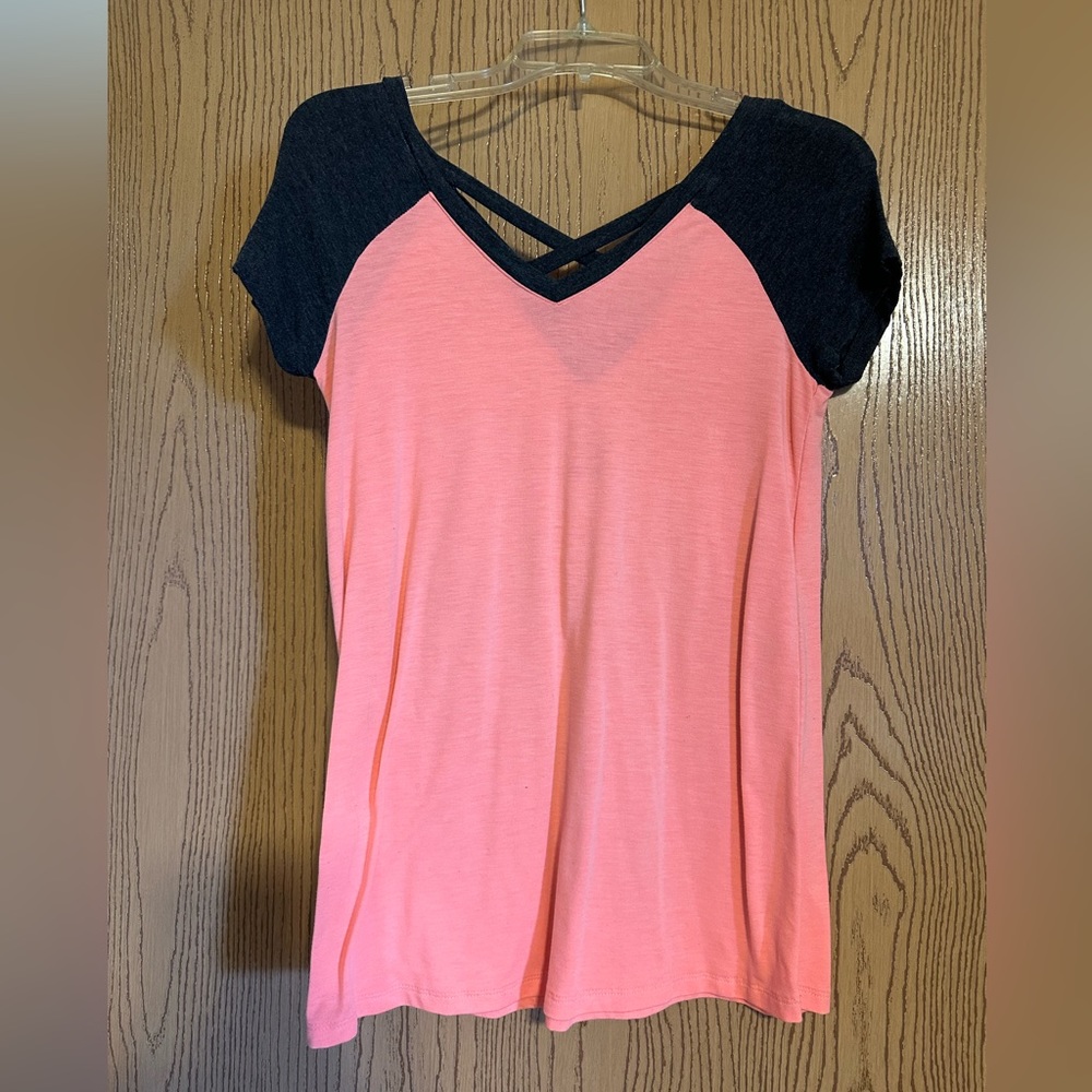 Peach/pink colored short sleeved flowy top with gray shoulders